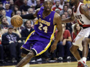 Los Angeles Lakers guard Kobe Bryant, left, drives on Portland Trail Blazers guard Will Barton.