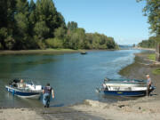 Boaters at Langsdorf Landing boat ramp access the Columbia River via the slough between Caterpillar Island and the Washington shore.