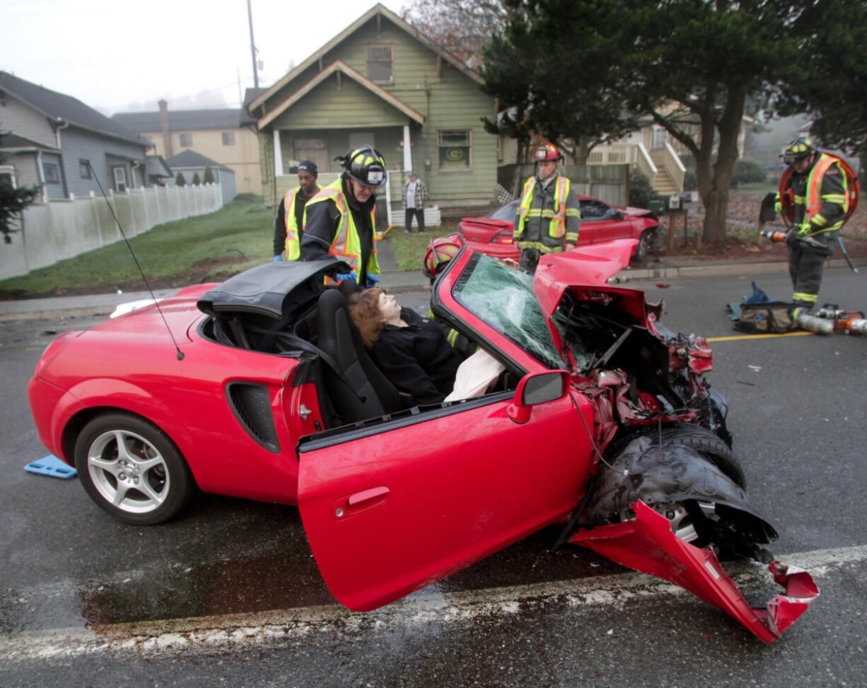 Everett firefighters prepare to remove Teri Cantor from her car Nov. 15 after a two car accident on South Third in Everett. Police believe Johnothon Bagley, the driver of the car that slammed into her, was impaired by drugs. Cantor physical pain has been immense, but there also are emotional scars, she said. At the hospital and rehab center, there were many indignities, the struggle to maneuver into a position to use a bedpan and the need to rely on others to bathe her.