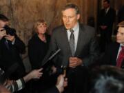 Standing in the wings of the Washington State House Chamber in Olympia on Monday with Rep. Jamie Pedersen, Gov.