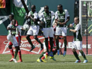 Portland Timbers players attempt to block a penalty kick during the second half of an MLS soccer game against FC Dallas in Portland, Ore., Saturday, June 15, 2013.  The Timbers won 1-0.