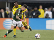 Portland Timbers defender Liam Ridgewell (24), pictured battling Harrison Afful of Columbus in the MLS Cup final, is looking forward to playing on Sunday in front of the Timbers fans.