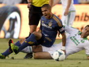 Galaxy midfielder Rafael Garcia, left, battles Timbers midfielder Diego Valeri.