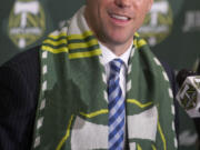 Associated Press photo
Timbers' coach Caleb Porter meets the media and makes some pointed comments about the team's striker.