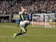 Portland Timbers midfielder Will Johnson blows a kiss to the crowd after scoring a goal against Chivas USA in Portland on May 12.