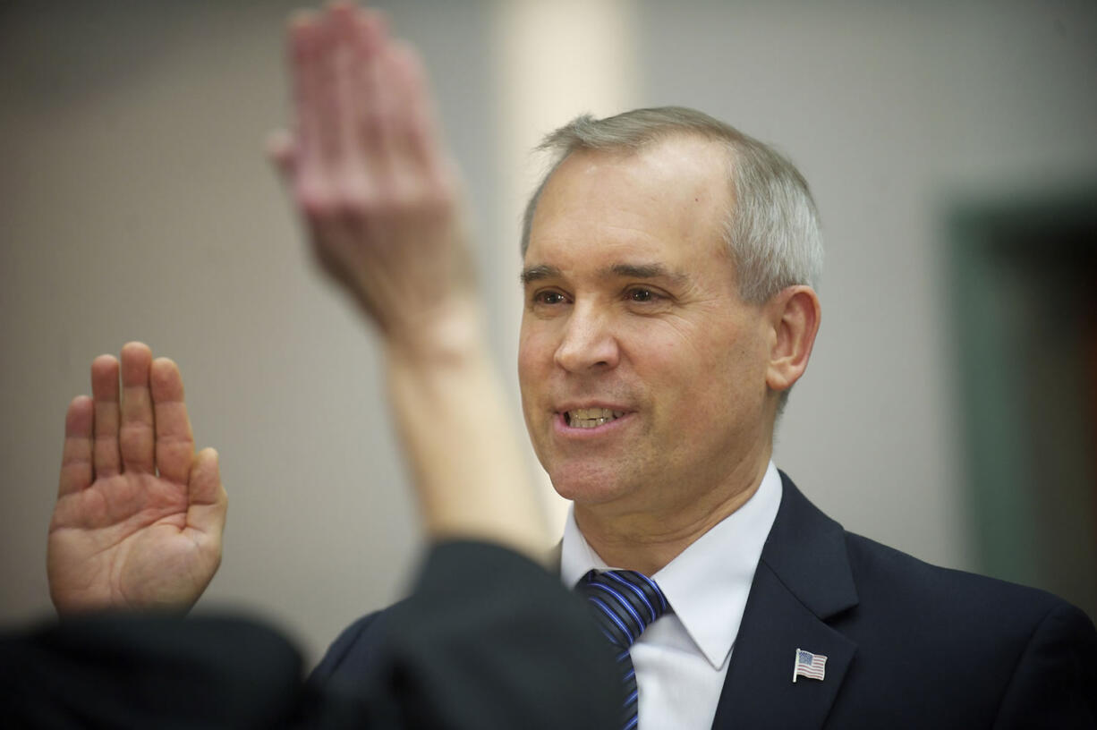 David Madore takes the oath of office Wednesday to start his term as a Clark County commissioner.