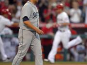 Seattle Mariners starting pitcher Aaron Harang (39) reacts after giving up a two-run home run to Los Angeles Angels' Josh Hamilton (32) in the second inning Monday.