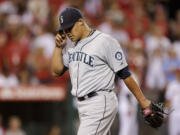 Seattle Mariners relief pitcher Yoervis Medina reacts after walking in the winning run against the Los Angeles Angels during the eight inning of a baseball game in Anaheim, Calif., Thursday, June 20, 2013.