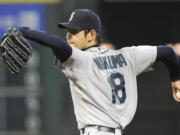 Seattle's Hisashi Iwakuma pitched seven scoreless innings Sunday at Houston, but the bullpen couldn't preserve the shutout as the Astros won 2-0.