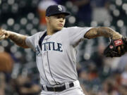 Seattle Mariners' Taijuan Walker delivers a pitch against the Houston Astros in the first inning of a baseball game on Friday, Aug. 30, 2013, in Houston.