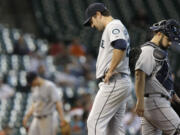 It was that kind of day for Seattle starting pitcher Joe Saunders, left, catcher Kelly Shoppach and the Mariners.