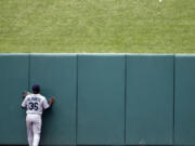 Seattle Mariners center fielder Abraham Almonte watches as a two-run home run by St.