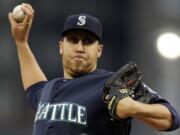 Seattle Mariners starting pitcher Aaron Harang delivers during the first inning of an interleague baseball game against the Pittsburgh Pirates in Pittsburgh, Tuesday, May 7, 2013. (AP Photo/Gene J.