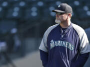 Seattle Mariners manager Eric Wedge watches batting practice before a baseball game against the Houston Astros in Seattle.