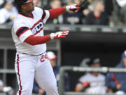 Chicago White Sox's Dayan Viciedo watches his walk-off home run during in the 10th inning Sunday to beat the Seattle Mariners 4-3.