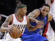 Dallas Mavericks forward Shawn Marion, right, defends against Portland Trail Blazers guard Damian Lillard during the second half Sunday.