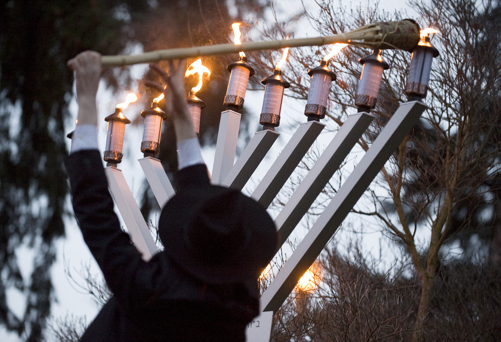 Rabbi Shmulik Greenberg of Chabad Lubavitch of Clark County, lights the Menorah during a Chanukah Celebration at Esther Short Park in 2008.