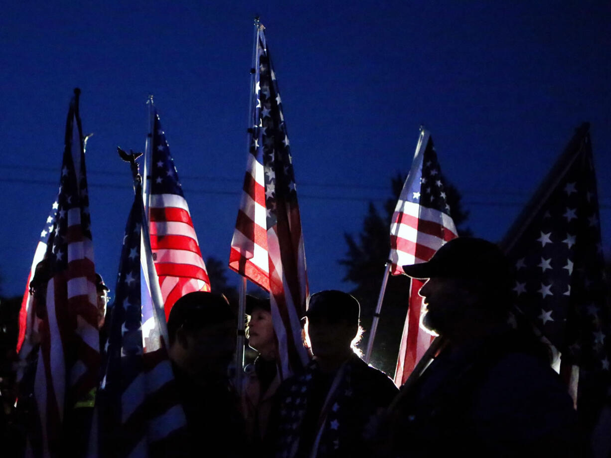 Members of the Patriot Guard file into a candlelight vigil outside Sparks Middle School in Sparks, Nev., on Wednesday.