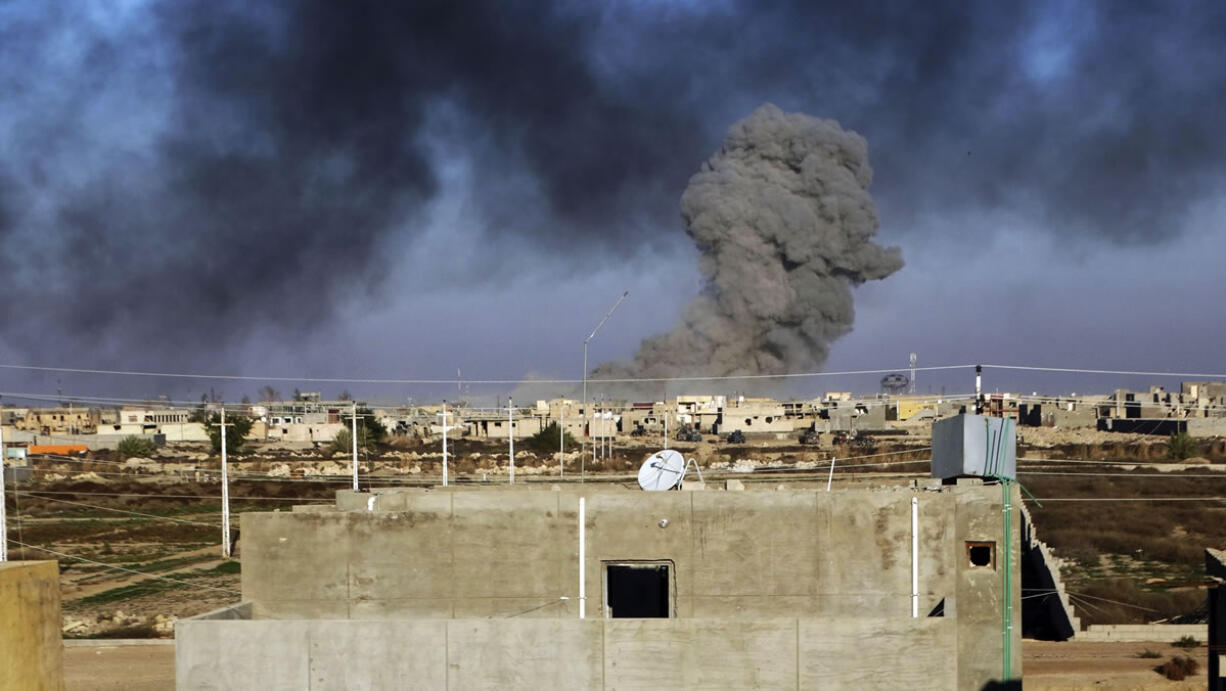 Smoke rises from Islamic State positions Friday following a U.S.-led coalition airstrike as Iraqi forces advance during their drive to retake the Islamic State-held town of Ramadi, 70 miles west of Baghdad, Iraq.