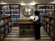 A librarian goes through books at the library of the Scientology center in the port city of Jaffa Tel Aviv, Israel on Nov. 7.