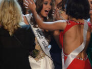 Miss Connecticut Erin Brady, center, reacts after winning the Miss USA 2013 pageant on Sunday in Las Vegas.