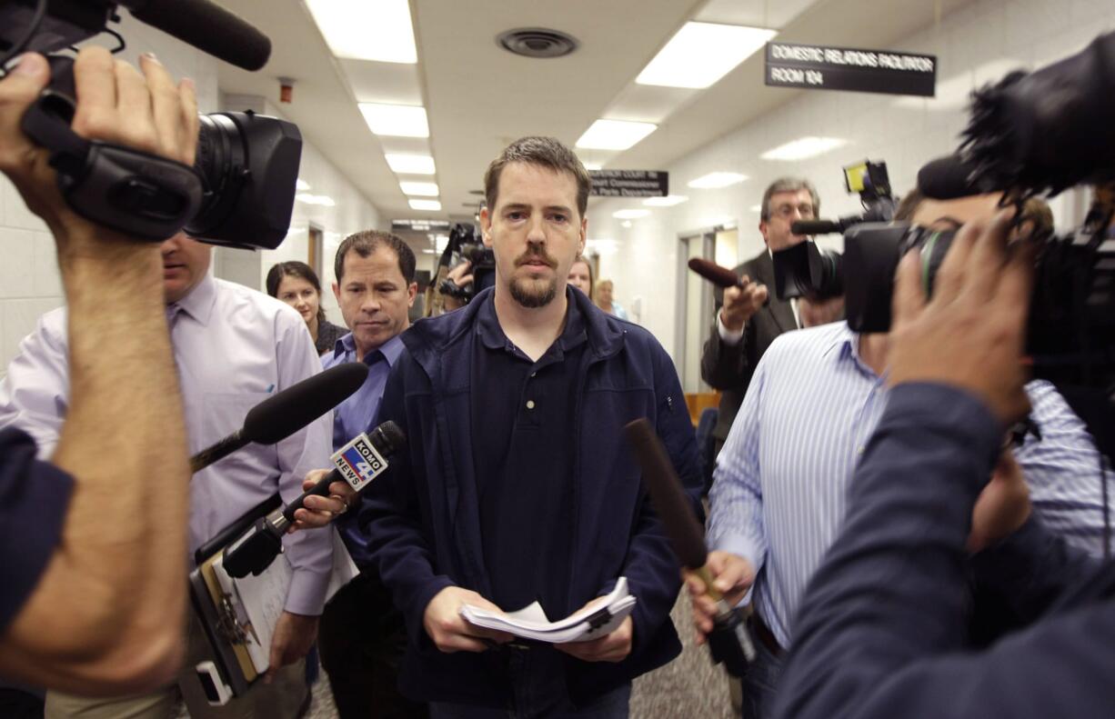 Josh Powell, the husband of missing Utah woman Susan Powell, is surrounded by reporters as he leaves a Pierce County courtroom in Tacoma.