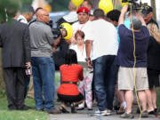 Michelle Knight arrives at Ariel Castro's  home in Cleveland on Wednesday. Castro held Knight, Amanda Berry and Gina DeJesus captive for nearly a decade at this property. The house was torn down as part of a deal that spared Ariel Castro a possible death sentence.