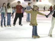 People skate at Mountain View Ice Arena.