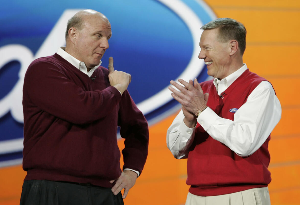 Paul Sakuma/Associated Press files
Ford Motor Company CEO and president Alan Mulally, right, listens to Microsoft CEO Steve Ballmer, left, during Mulally's keynote address Jan. 8 at the International Consumer Electronics Show in Las Vegas.