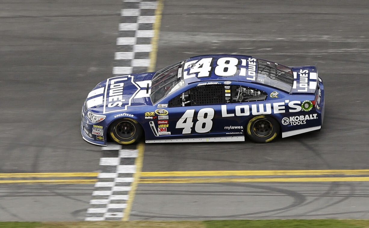 Jimmie Johnson crosses the finish line to win the Daytona 500 on Sunday.