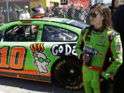 Danica Patrick stands by her car after qualifying for the NASCAR Daytona 500 at Daytona International Speedway, Sunday, Feb. 17, 2013, in Daytona Beach, Fla.