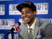 Lehigh's CJ McCollum, picked by the Portland Trail Blazers in the first round of the NBA basketball draft, smiles during a news conference Thursday in New York.