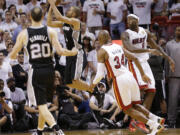 San Antonio Spurs point guard Tony Parker (9) makes the final shot of the game against the Miami Heat during the second half of Game 1 of the NBA Finals basketball game, Thursday, June 6, 2013 in Miami.