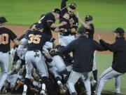 Players on the Oregon State baseball team celebrate their 4-3 win over Kansas State on Monday to win the super regional and advance to the College World Series