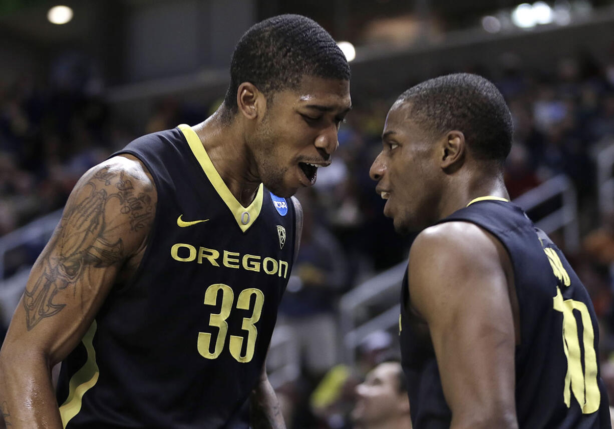 Oregon's Carlos Emory, left, and Johnathan Loyd celebrate the Ducks' 74-57 victory over Saint Louis on Saturday.