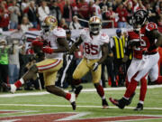 San Francisco's Frank Gore (21) breaks away for a 9-yard touchdown to put the 49ers in front of the Falcons 28-24 in the fourth quarter Sunday.