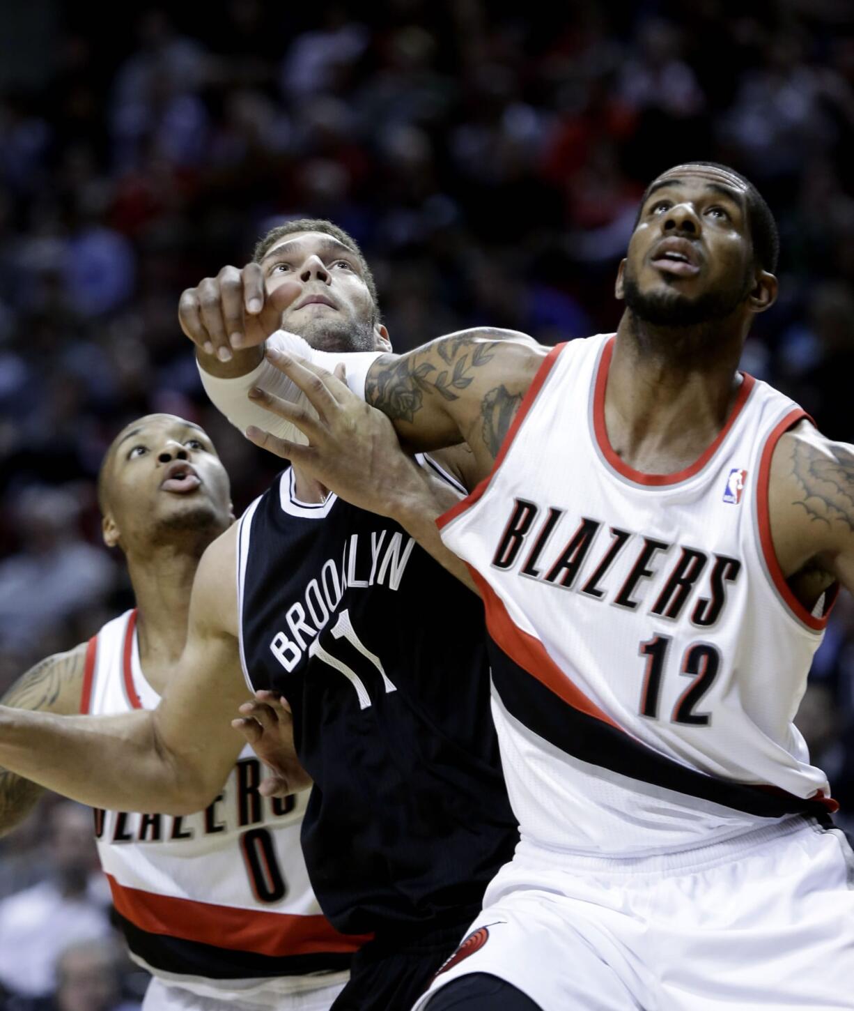 LaMarcus Aldridge (12), tangling with the Nets' Brook Lopez, could miss his third consecutive game due to an ankle injury.