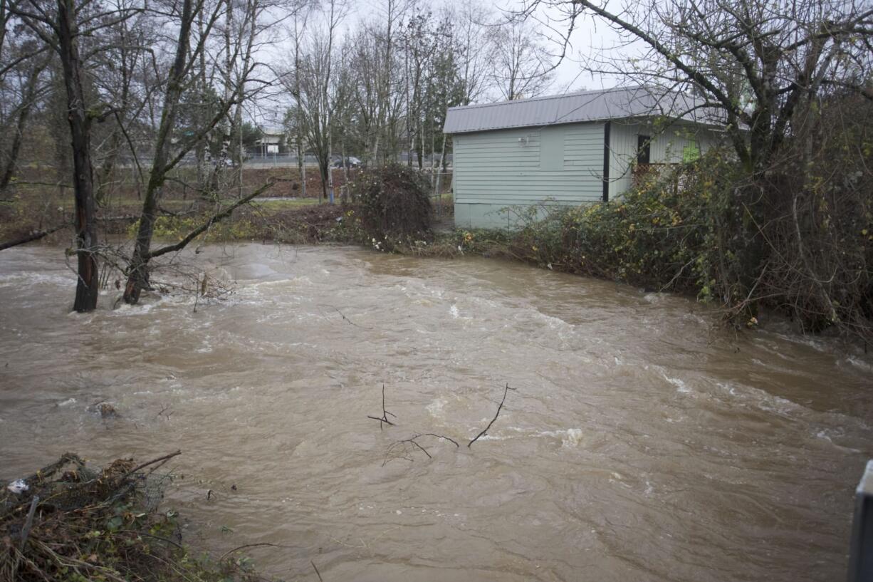 Johnson Creek swells near flood stage Wednesday in Portland.