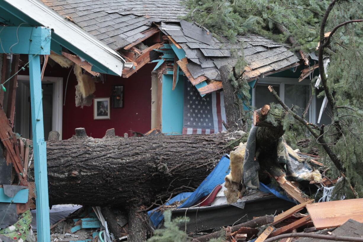 A large fir tree fell on a house overnight and killed an 60-year-old woman in Portland on Wednesday,  as the Pacific Northwest was soaked by another night of heavy rain. More than 5 inches of rain have fallen on Portland since Sunday, and strong winds have uprooted trees from the saturated ground.