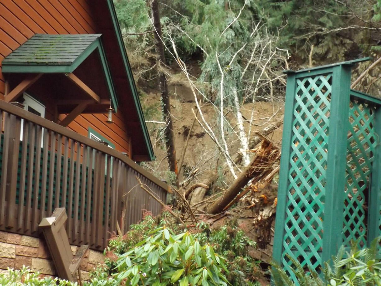 A landslide early Friday morning destroyed a home with a man, woman and two dogs inside. The man and one of the dogs escaped.