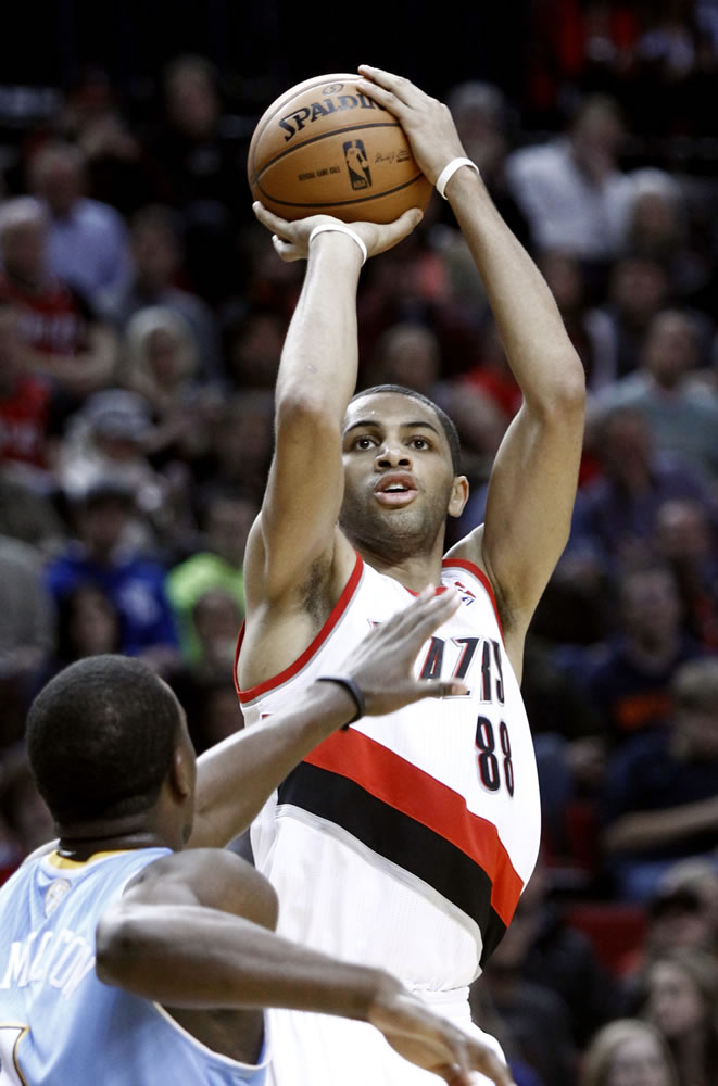 Portland's Nicolas Batum (88) shoots over Denver's Jordan Hamilton during the second half Thursday.