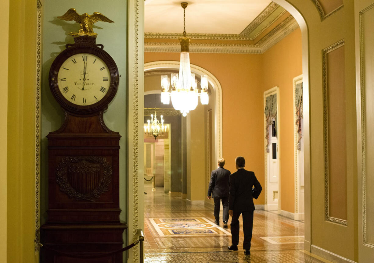 The Ohio Clock outside the Senate Chamber on Capitol Hill shows the time of 12:01 a.m.