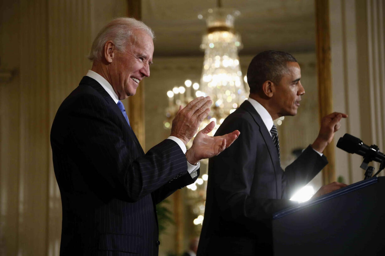 Vice President Joe Biden applauds as President Barack Obama speaks about immigration reform Thursday in the East Room of the White House in Washington.