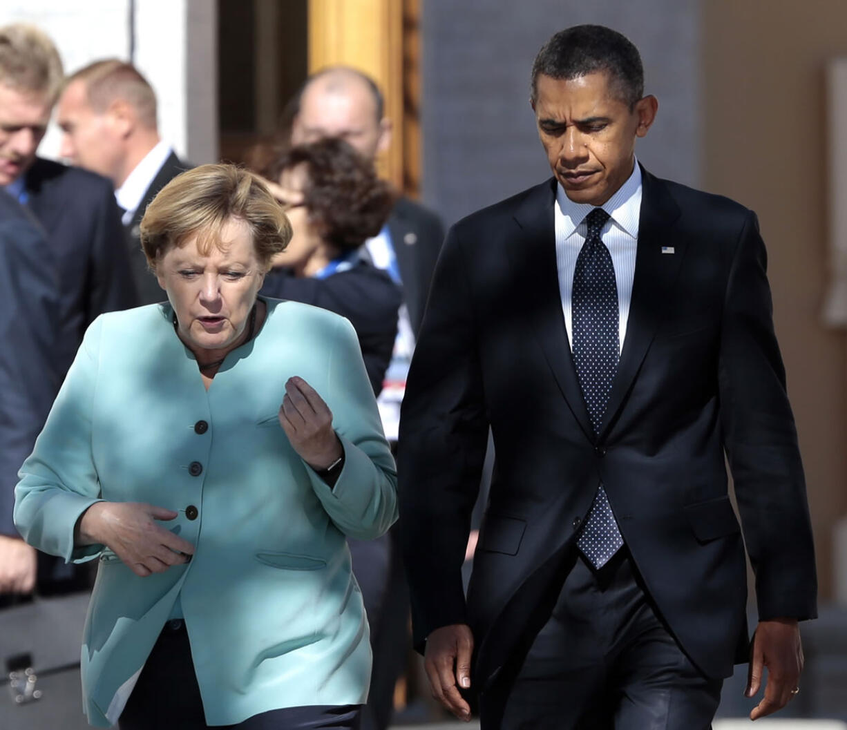 President Barack Obama, right, walks with Germany's Chancellor Angela Merkel prior to a group photo of G-20 leaders outside of the Konstantin Palace in St.