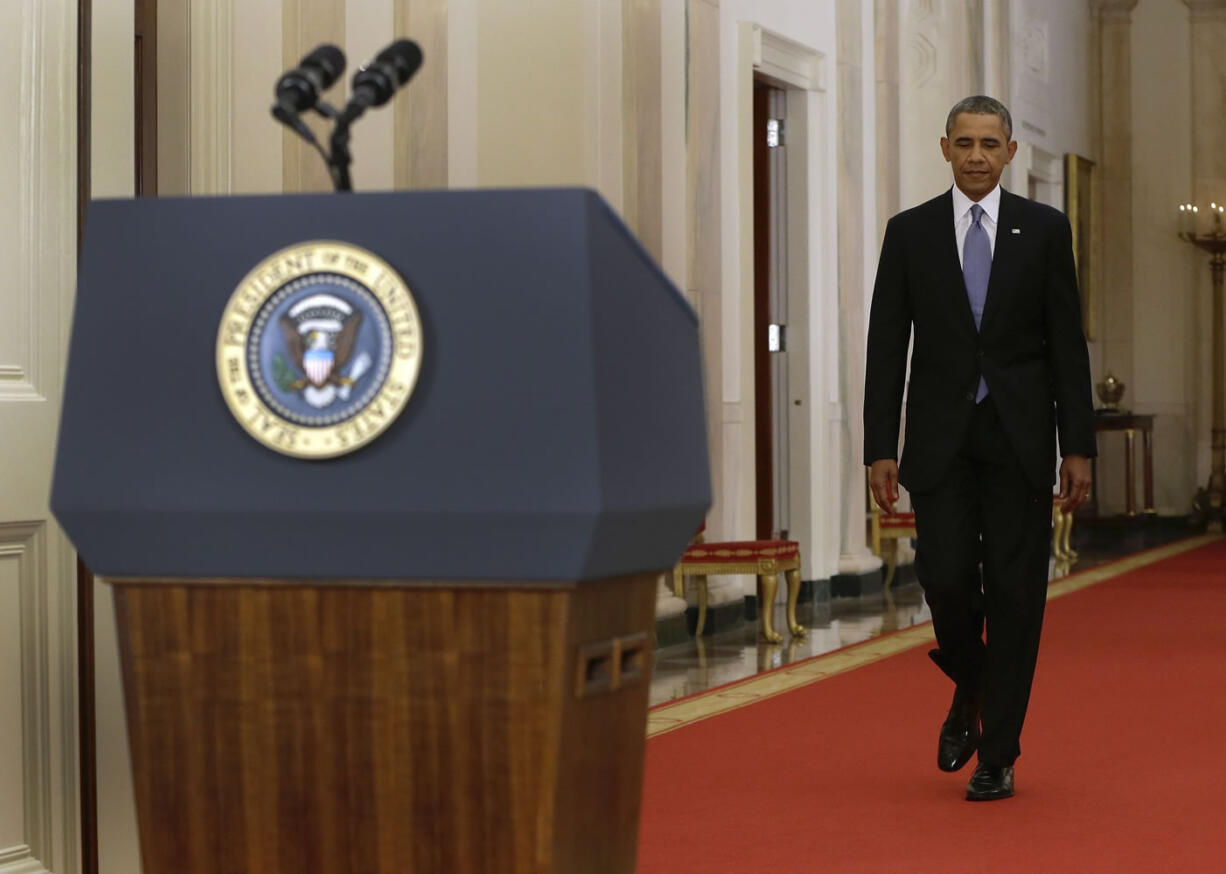 President Barack Obama walks to the podium before addressing the nation in a live televised speech from the East Room of the White House in Washington on Tuesday.