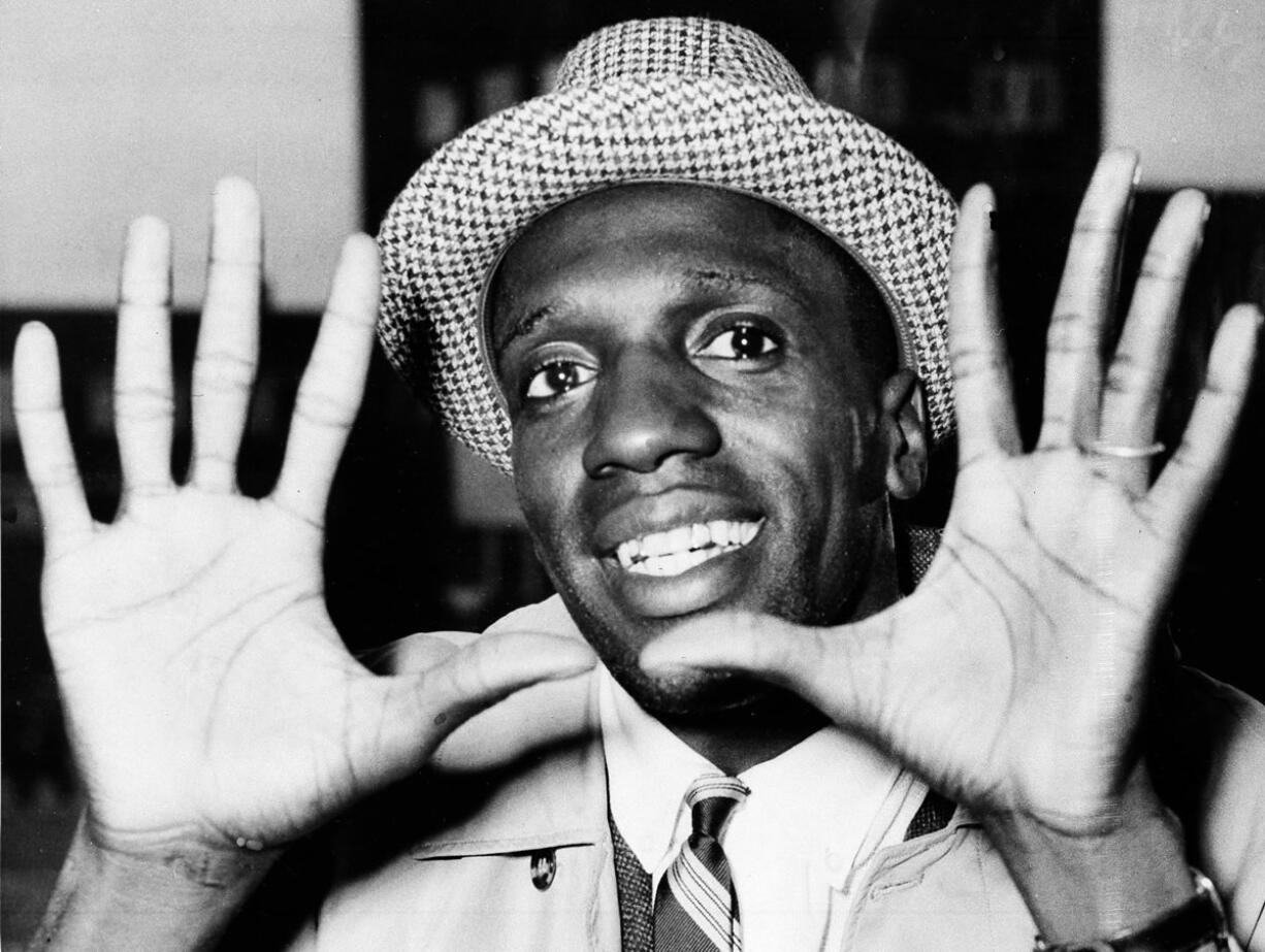 Meadowlark Lemon, of the Harlem Globetrotters, shows off his large hands on arrival in London where the team was to perform at the Empire Pool in Wembley for a week. Lemon, known as the Globetrotters&#039; &quot;clown prince&quot; of basketball, died Sunday in Scottsdale, Ariz. He was 83.