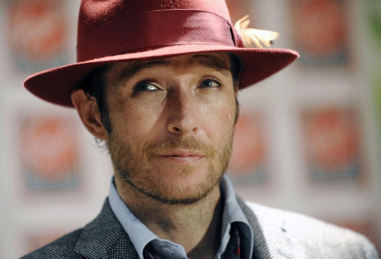 Singer Scott Weiland poses Nov. 24, 2008, before signing copies of his new album, &quot;Happy in Galoshes,&quot; in Los Angeles. Weiland, the former frontman for the Stone Temple Pilots and Velvet Revolver, has died. He was 48. The singer&#039;s manager confirmed the death to The Associated Press early Friday.