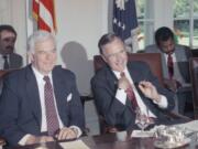 In this June 6, 1989 file photo, House Speaker Tom Foley of Washington sits next to U.S. President George H. Bush during a meeting with the congressional leadership at the White House in Washington.