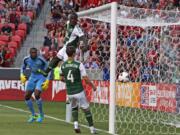 Portland Timbers' Donovan Ricketts, left, Andrew Jean-Baptiste, above, and Will Johnson watch a goal by Real Salt Lake during the first half of a U.S. Open Cup soccer game Wednesday in Sandy, Utah.