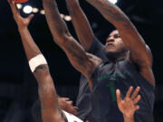 Oregon forward Jordan Bell (1) blocks the shot of Alabama guard Justin Coleman (5) during the second half of an NCAA college basketball game Monday, Dec. 21, 2015, in Birmingham, Ala. Oregon won 72-68.